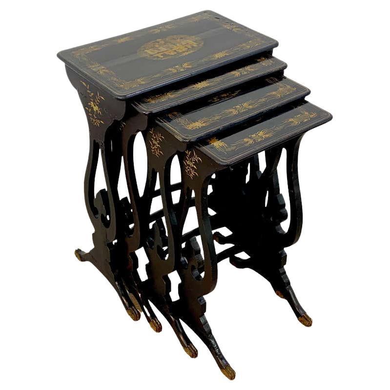 Antique Chinoiserie Lacquered Nesting Tables Set of 4 China 1860s: Antique Chinoiserie Lacquered Nesting Tables Set of 4 China 1860s This exquisite set of four antique Chinese export nesting tables showcases the elegant Chinoiserie style typical of the mid-19th centu