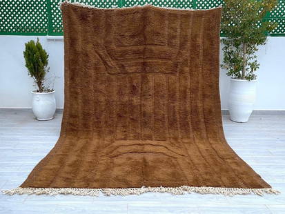Authentic Moroccan Berber Wool Rug 9.84 x 6.56 Feet: Authentic Moroccan Berber Wool Rug 9.84 x 6.56 Feet Discover the beauty of this Elegant Soft Engraved Brown Rug, a stunning example of authentic Moroccan craftsmanship. Handwoven in the Atlas Mountain