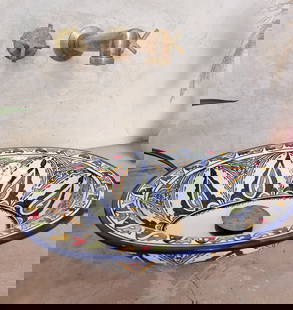 Handcrafted Moroccan Oval Ceramic Sink with Copper and Silver Drains: Handcrafted Moroccan Oval Ceramic Sink with Copper and Silver Drains Enhance your bathroom or kitchen with this stunning Moroccan washbasin sink, expertly handcrafted by skilled artisans in Fes. Made