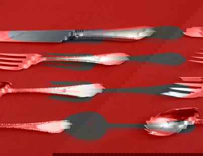 Tiffany & Co Feather Edge Sterling Silver 4-Piece Place Setting: Tiffany & Co Feather Edge Sterling Silver 4-Piece Place Setting Enhance your dining experience with this exquisite 4-piece regular size place setting from Tiffany & Co.'s Feather Edge pattern. Crafted