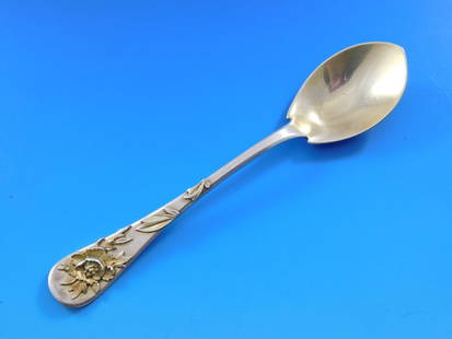 Tiffany & Co Sterling Silver Ice Cream Spoon 6'' Applied Gilt Flowers 1880s: Tiffany & Co Sterling Silver Ice Cream Spoon 6'' Applied Gilt Flowers 1880s This exquisite Tiffany & Co. ice cream spoon showcases the elegant Lap Over Edge pattern, crafted from sterling silver and d