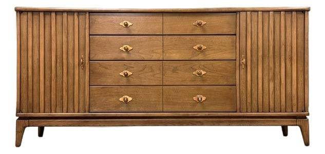 1960s Broyhill Expressions Mid Century Dresser with Copper Pulls: 1960s Broyhill Expressions Mid Century Dresser with Copper Pulls Discover a stunning mid-century modern dresser from the 1960s, crafted by Broyhill Expressions. This elegant piece features twelve spac