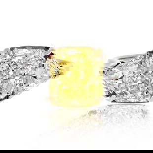 GIA Certified 3.04ct Fancy Intense Yellow Diamond Ring in Platinum and 18K Gold: GIA Certified 3.04ct Fancy Intense Yellow Diamond Ring in Platinum and 18K Gold This stunning Fancy Yellow Ring features a captivating GIA certified 3.04 ct Fancy Intense Radiant Cut Diamond at its ce