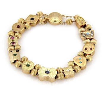 Vintage 14k Yellow Gold Multi-Color Gem Slide Charm Bracelet: Vintage 14k Yellow Gold Multi-Color Gem Slide Charm Bracelet Enhance your jewelry collection with this stunning vintage bracelet crafted from 14k yellow gold. Featuring 11 slide charms set with a vibr