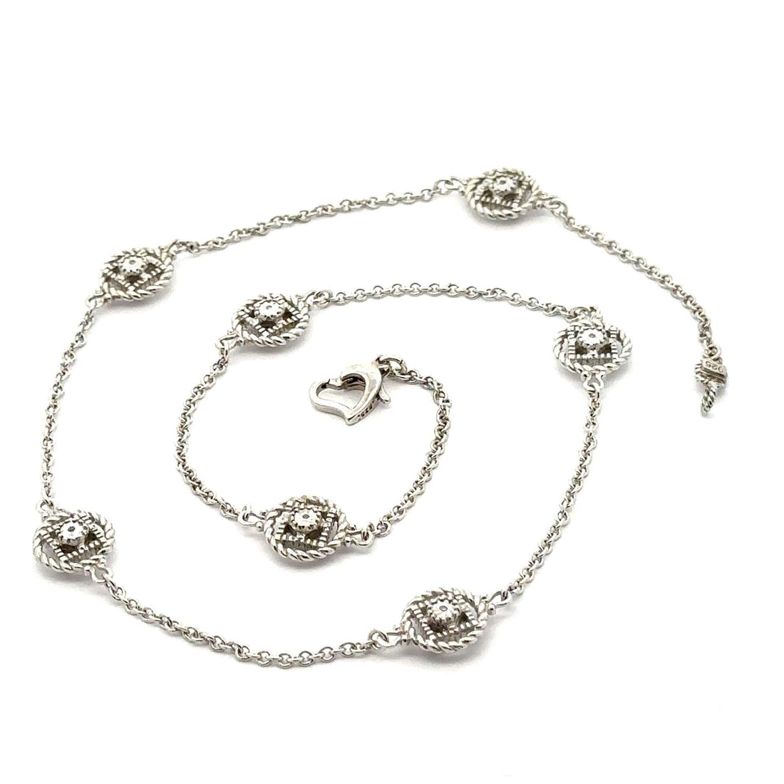Yard Sterling Silver Twisted Rope Diamond Necklace 17.25 Inches: Yard Sterling Silver Twisted Rope Diamond Necklace 17.25 Inches Crafted in luxurious sterling silver, this exquisite necklace features 14 natural genuine diamonds, skillfully set in a single cut bezel