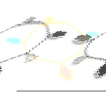 18k Yellow Gold Charm Bracelet with Diamonds and Gemstones: 18k Yellow Gold Charm Bracelet with Diamonds and Gemstones This exquisite 18k yellow gold charm bracelet features five unique good luck charms, each adorned with sparkling diamonds and vibrant gemston