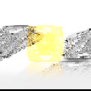 5.81ct Fancy Intense Radiant Cut Three Stone Diamond Engagement Ring in Platinum and 18K Yellow Gold: 5.81ct Fancy Intense Radiant Cut Three Stone Diamond Engagement Ring in Platinum and 18K Yellow Gold This exquisite engagement ring features a stunning 5.81ct Fancy Intense Radiant Cut diamond set in