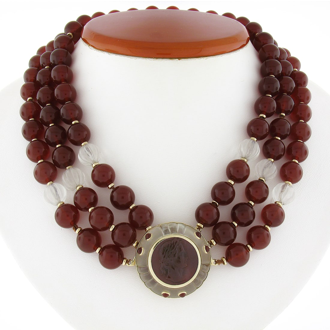 Trianon 3 Strand Carnelian Rock Crystal Necklace with 14k Gold Cameo Pendant: Trianon 3 Strand Carnelian Rock Crystal Necklace with 14k Gold Cameo Pendant This stunning Trianon necklace features a captivating 3-strand design crafted from natural carnelian and rock crystal beads