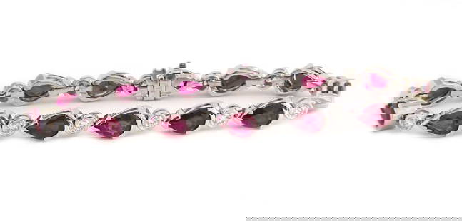 Vintage Diamond Ruby Tennis Bracelet 14k White Gold Pear Link: Vintage Diamond Ruby Tennis Bracelet 14k White Gold Pear Link This exquisite Diamond Ruby 14k White Gold Pear Link Tennis Bracelet is a vintage fine jewelry piece that effortlessly combines elegance a
