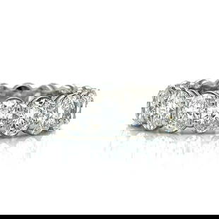 Platinum 7.00 Ct Diamond Eternity Band with 16 Oval Diamonds: Platinum 7.00 Ct Diamond Eternity Band with 16 Oval Diamonds Exquisite Platinum Diamond Eternity Band featuring a total of approximately 7.00 carats of stunning oval diamonds. This luxurious piece is