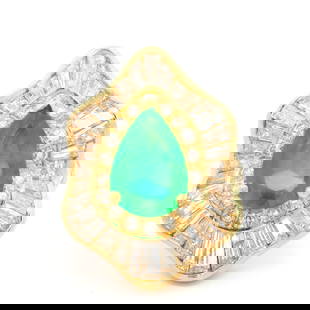 18k Yellow Gold GIA 5.05ct Pear Emerald Diamond Ballerina Ring: 18k Yellow Gold GIA 5.05ct Pear Emerald Diamond Ballerina Ring This exquisite cocktail ring features a stunning pear cut emerald, weighing approximately 2.05ct, set in solid 18k yellow gold. The emera