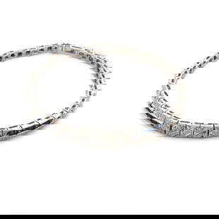 Elegant Art Deco 18k White Gold Diamond and Blue Stone Bracelet: Elegant Art Deco 18k White Gold Diamond and Blue Stone Bracelet This stunning Art Deco style bracelet is exquisitely crafted from 18k white gold. It features box-shaped links adorned with square-cut b