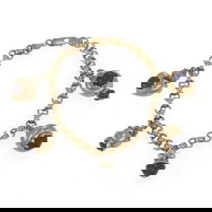 14k Yellow Gold Bracelet with Lapis Pearls Ruby Charms: 14k Yellow Gold Bracelet with Lapis Pearls Ruby Charms This lovely bracelet is crafted from 14k yellow gold featuring 5 dangling charms with assorted shapes and sizes, 4 have lapis gemstones, one with