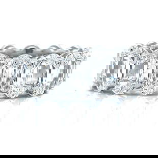 Platinum 11.00 Ct Oval-cut Diamond Eternity Ring: Platinum 11.00 Ct Oval-cut Diamond Eternity Ring This exquisite platinum eternity band features 14 stunning oval-cut diamonds, collectively weighing approximately 11.00 carats. The diamonds exhibit E-