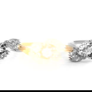 Antique Edwardian 18k Gold Platinum Diamond Bypass Ring 0.25ctw: Antique Edwardian 18k Gold Platinum Diamond Bypass Ring 0.25ctw This exquisite Antique Edwardian bypass ring features a stunning combination of 18k yellow gold and platinum, adorned with a total of ni