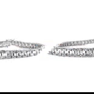Platinum 18K White Gold 21 Ct Diamond Tennis Bracelet: Platinum 18K White Gold 21 Ct Diamond Tennis Bracelet This exquisite tennis bracelet features a stunning combination of platinum and 18K white gold, showcasing 57 graduated emerald-cut diamonds. Each