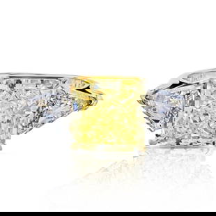 5.08 Carat GIA Radiant Cut Fancy Intense Yellow Diamond Ring: 5.08 Carat GIA Radiant Cut Fancy Intense Yellow Diamond Ring This stunning three-stone engagement ring features a remarkable 5.08 carat radiant cut fancy intense yellow diamond with SI1 clarity, certi