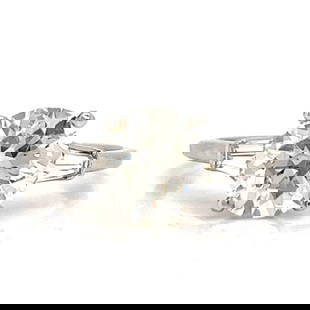 GIA Certified 3.21 Ct Platinum Diamond Ring with Baguettes: GIA Certified 3.21 Ct Platinum Diamond Ring with Baguettes This exquisite platinum ring features a stunning 3.21 Ct. GIA Certified round diamond, known for its J color and VS2 clarity. The diamond mea