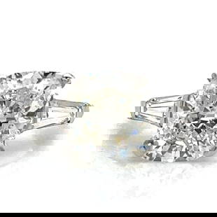 Platinum 4.73 Ct IGI Certified Cushion Cut Diamond Ring with Baguette Accents: Platinum 4.73 Ct IGI Certified Cushion Cut Diamond Ring with Baguette Accents This exquisite diamond ring features a stunning 4.73 Ct. IGI Certified cushion-cut diamond, showcasing a beautiful I color