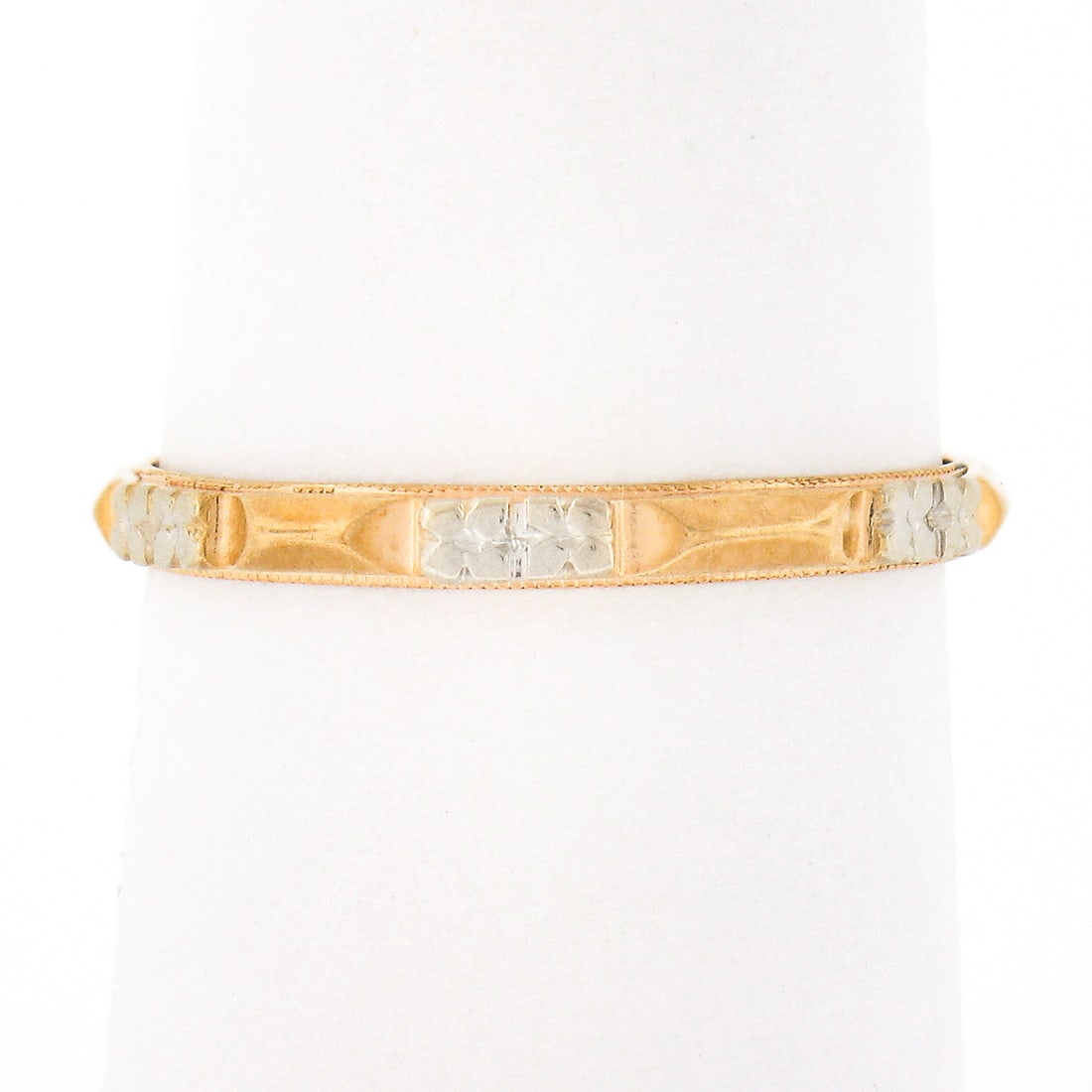 1941 Antique 14k Gold Floral Eternity Stack Band Ring: 1941 Antique 14k Gold Floral Eternity Stack Band Ring This exquisite antique eternity stack band ring from 1941 is meticulously crafted from solid 14k yellow gold, complemented by white gold accents. 