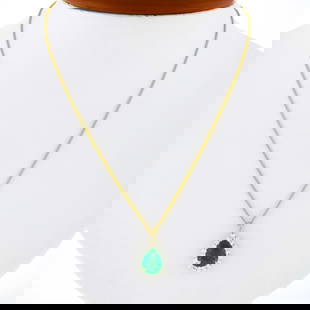 14k Gold SSEF Certified Pear Emerald Diamond Halo Pendant Necklace: 14k Gold SSEF Certified Pear Emerald Diamond Halo Pendant Necklace This stunning pendant necklace features a vibrant pear-shaped emerald, weighing 2.24 carats, beautifully set in solid 14k yellow gold