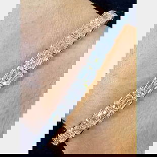Platinum 16.83 Ct Emerald-Cut Diamond Tennis Bracelet: Platinum 16.83 Ct Emerald-Cut Diamond Tennis Bracelet This exquisite tennis bracelet features 34 stunning emerald-cut diamonds, totaling 16.83 carats, set in luxurious platinum. The diamonds exhibit H