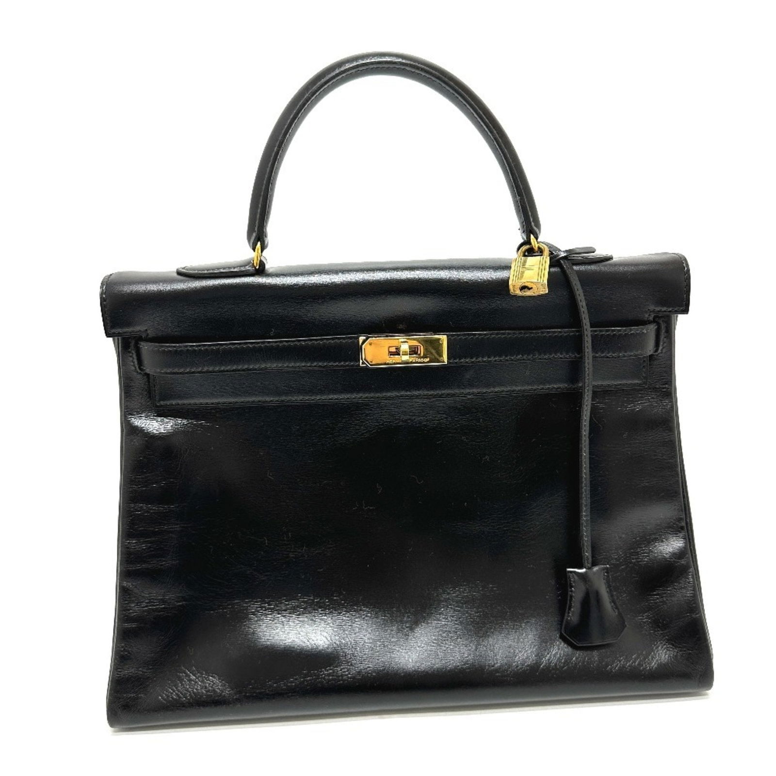 HERMES Kelly 35 Tote Bag Black Box Calf Leather Women's S Mark: HERMES Kelly 35 Tote Bag Black Box Calf Leather Women's S Mark Introducing the exquisite HERMES Kelly 35, an iconic tote bag designed for the modern woman. Crafted from luxurious box calf leather in a