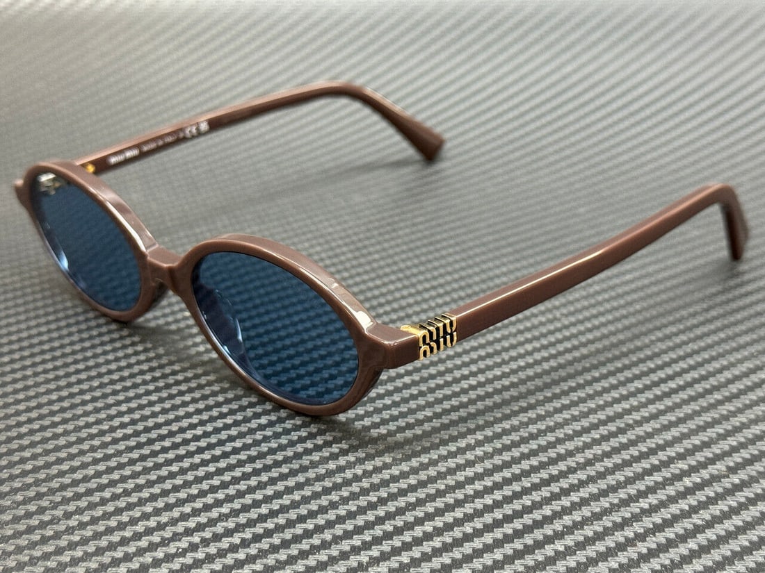 Miu Miu MU 04ZS 22C60O Moka Blue Women's Sunglasses with Authenticity: Miu Miu MU 04ZS 22C60O Moka Blue Women's Sunglasses with Authenticity Elevate your eyewear collection with these stunning Miu Miu MU 04ZS 22C60O sunglasses. Featuring a chic moka frame complemented by