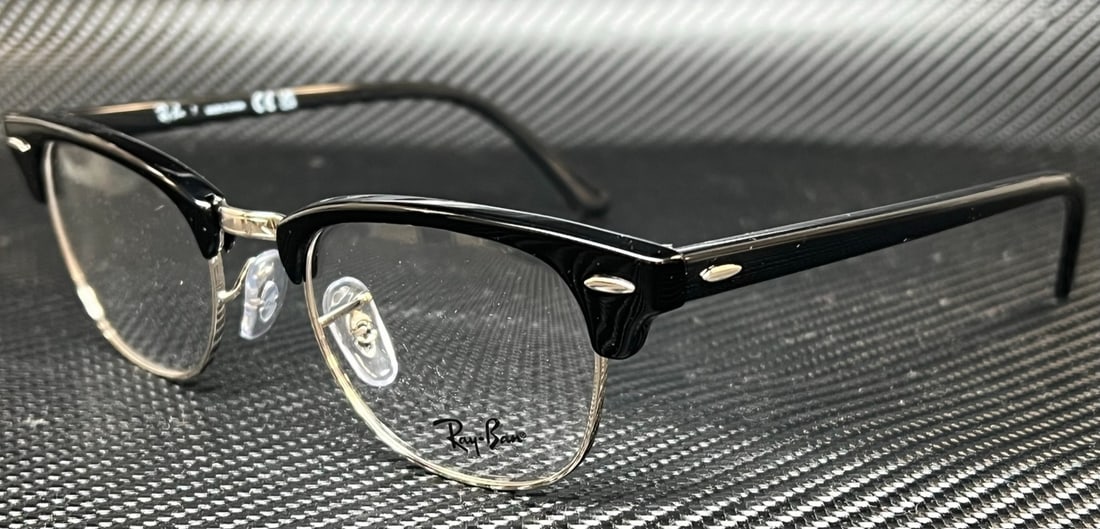 Ray Ban RX5154 2000 Black Square Unisex Eyeglasses with Case: Ray Ban RX5154 2000 Black Square Unisex Eyeglasses with Case Discover the perfect blend of style and functionality with these RAY BAN RX5154 2000 Black Square Eyeglasses. These unisex eyeglasses featu