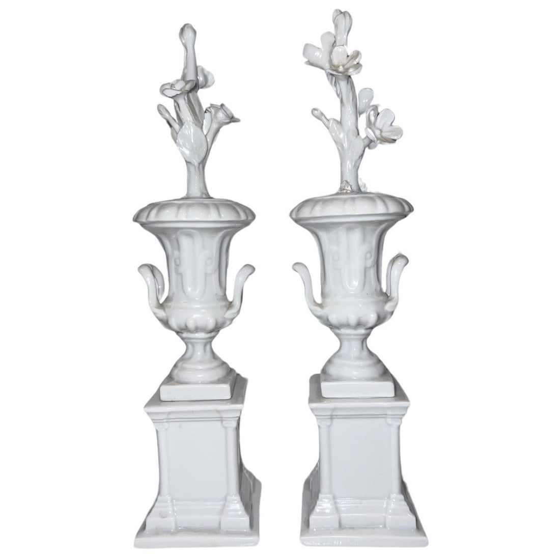 Set of 2 Capodimonte Neoclassical Blanc De Chine Urns: Set of 2 Capodimonte Neoclassical Blanc De Chine Urns This exquisite pair of Neoclassical style blanc de chine porcelain urns showcases a delicate floral stem motif that enhances their charm. Crafted