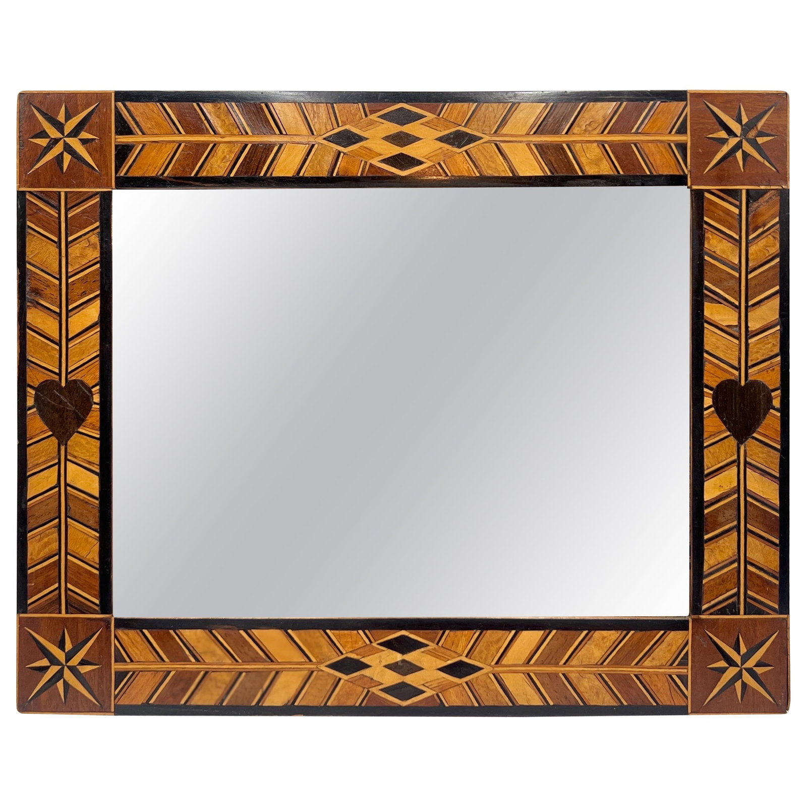 Antique Folk Art Mirror with Exotic Wood Inlay USA 1900: Antique Folk Art Mirror with Exotic Wood Inlay USA 1900 This antique American folk art mirror showcases exquisite craftsmanship with exotic wood inlays shaped into hearts, stars, and geometric pattern