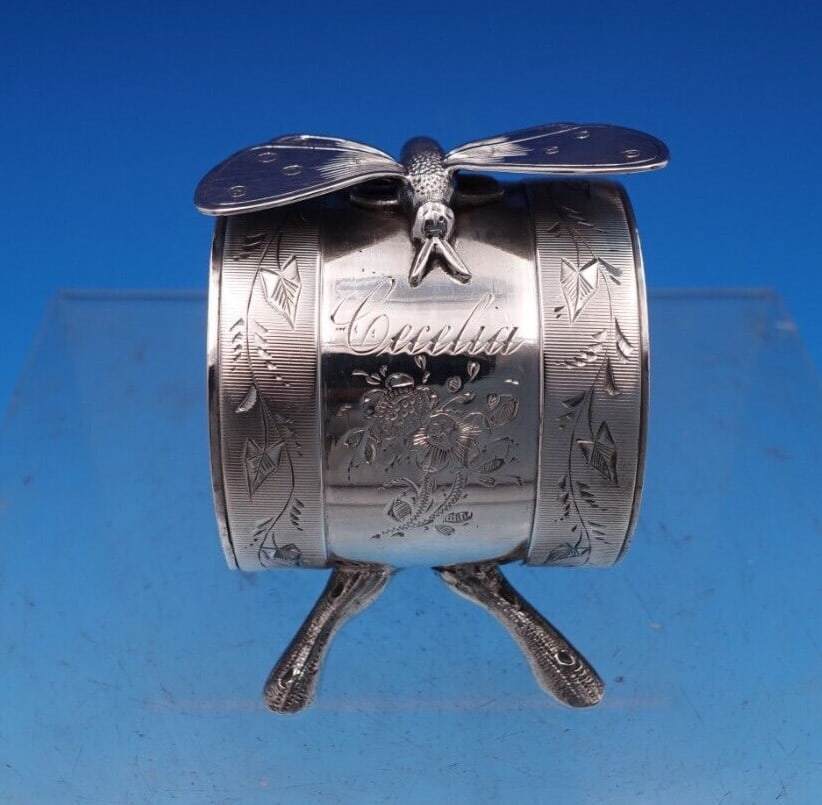 Koehler & Ritter Rare Coin Silver Napkin Ring with 3-D Moth 2.25 x 2 Inches: Koehler & Ritter Rare Coin Silver Napkin Ring with 3-D Moth 2.25 x 2 Inches This exquisite napkin ring, crafted by Koehler & Ritter, showcases a stunning 3-D moth design atop a delicate twig stand. Ma