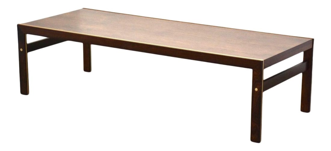 Illum Wikkelso Rosewood Brass Coffee Table 60.25in x 24in x 16in Silkeborg: Illum Wikkelso Rosewood Brass Coffee Table 60.25in x 24in x 16in Silkeborg A mid century modern rosewood & brass coffee table designed by Illum Wikkels for Silkeborg of Denmark. Professionally refinis
