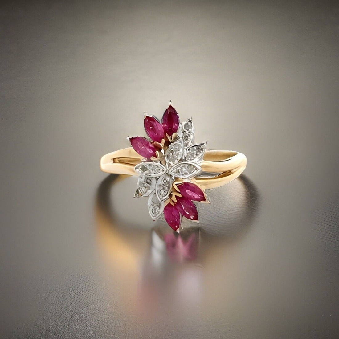 14K Yellow Gold Marquise Ruby Diamond Cluster Cocktail Ring: 14K Yellow Gold Marquise Ruby Diamond Cluster Cocktail Ring This stunning estate cocktail ring features a vibrant marquise-cut ruby at its center, elegantly surrounded by 16 sparkling diamonds in a un