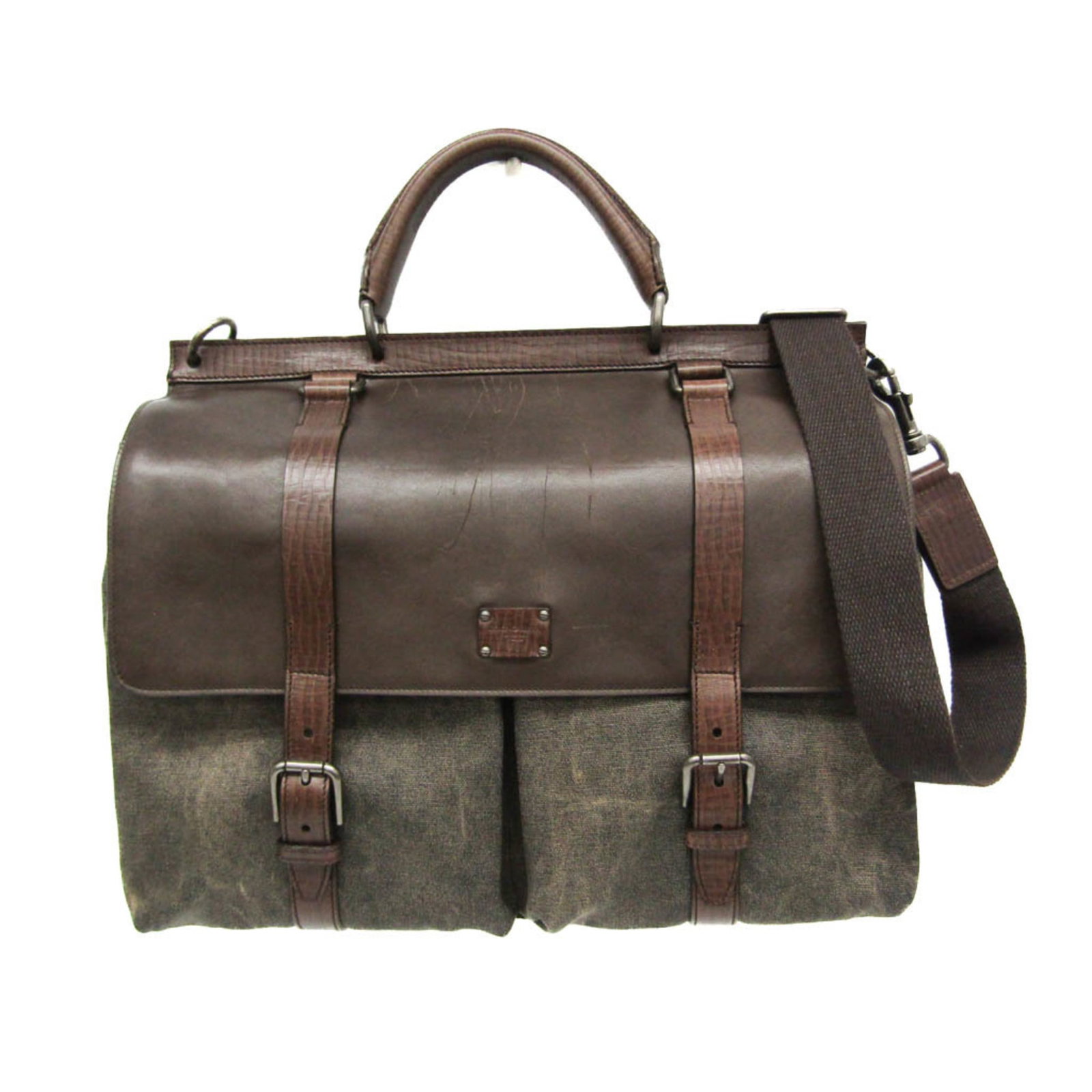 Dolce & Gabbana Brown Canvas Leather Handbag 31cm x 40cm x 12.5cm: Dolce & Gabbana Brown Canvas Leather Handbag 31cm x 40cm x 12.5cm This stylish handbag by Dolce & Gabbana is a versatile accessory suitable for both women and men. Crafted from a combination of canvas
