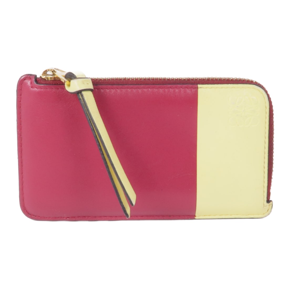 LOEWE Calfskin Coin Card Case in Vibrant Yellow: LOEWE Calfskin Coin Card Case in Vibrant Yellow This stylish LOEWE Coin Card Case is crafted from premium calfskin leather, showcasing a vibrant yellow color. The card case features a sleek design tha