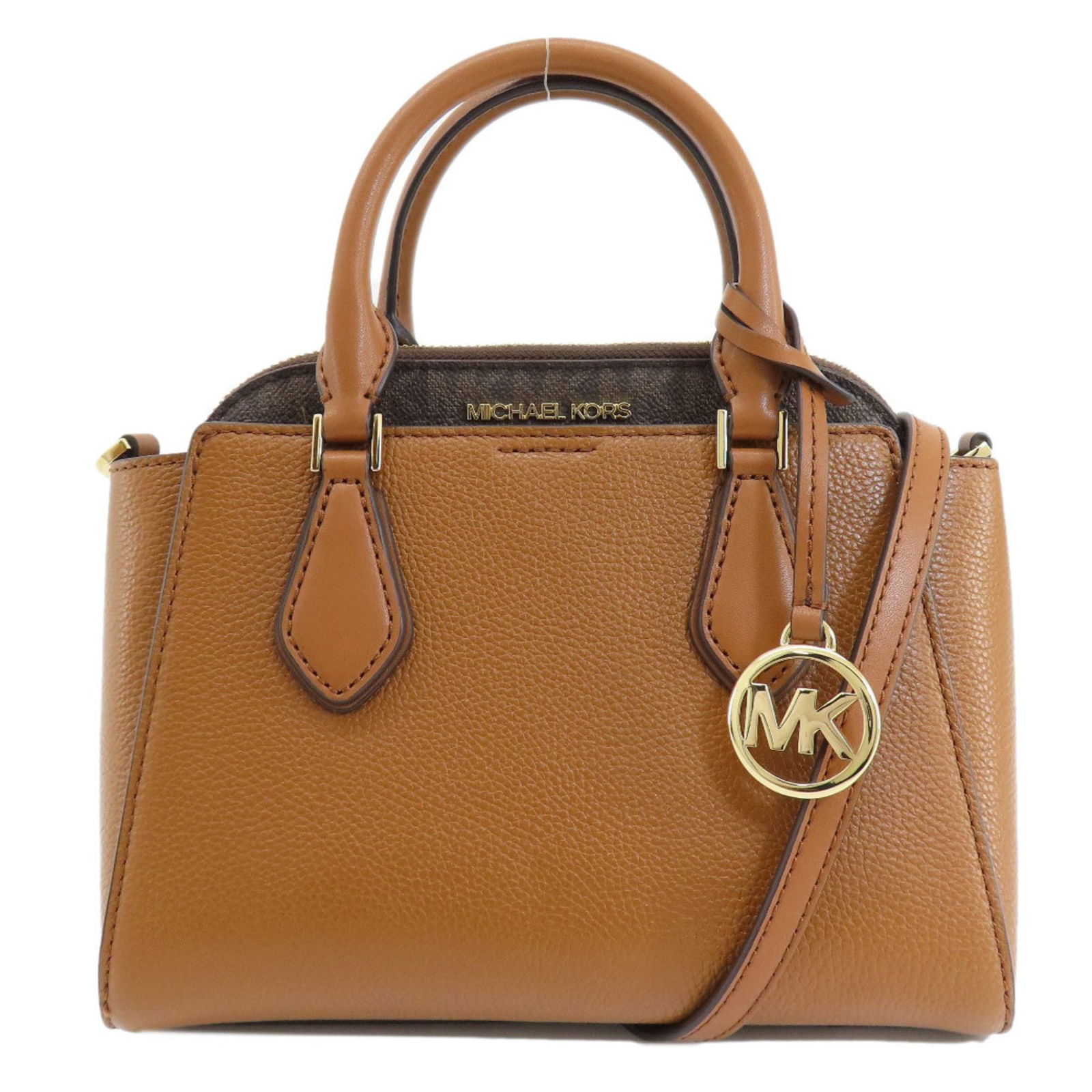 Michael Kors Brown Leather Handbag for Women 19cm x 25cm: Michael Kors Brown Leather Handbag for Women 19cm x 25cm This Michael Kors handbag is designed for women, crafted from high-quality leather in a sophisticated brown color. The bag features a spacious