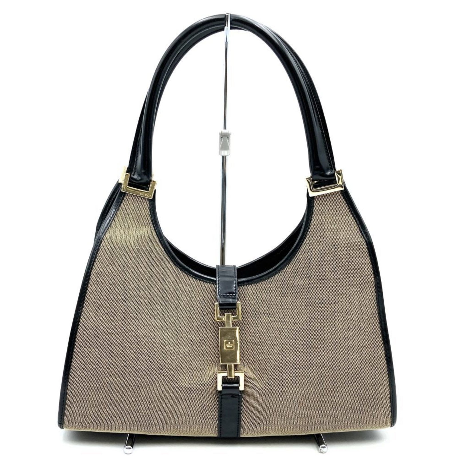 GUCCI Jackie 002 1067 Gray Beige Handbag Canvas Leather Women's: GUCCI Jackie 002 1067 Gray Beige Handbag Canvas Leather Women's The GUCCI Jackie 002 1067 Handbag is a stylish accessory crafted from a blend of canvas and leather, featuring an elegant gray and beige