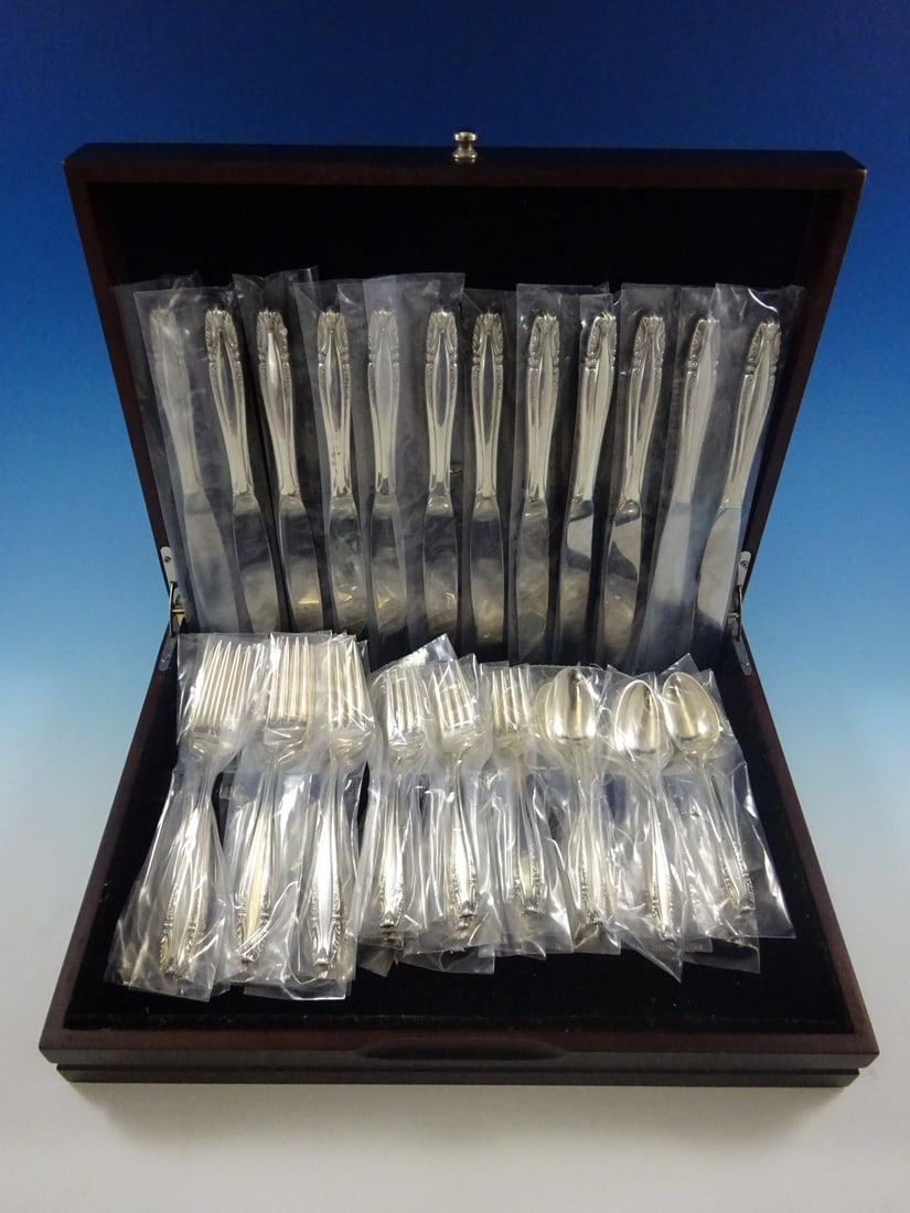 Wallace Stradivari Sterling Silver Flatware Set 48 Pcs for 12 Service: Wallace Stradivari Sterling Silver Flatware Set 48 Pcs for 12 Service Enhance your dining experience with the Stradivari by Wallace Sterling Silver Flatware Set, featuring a comprehensive collection o
