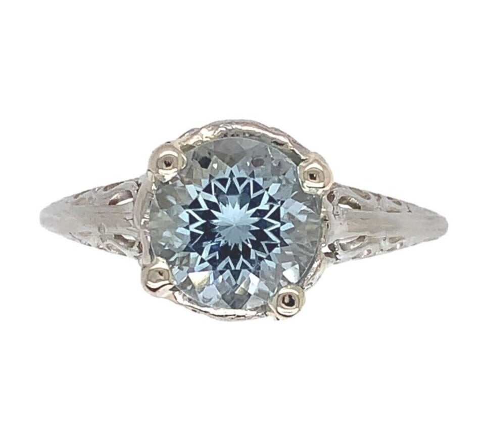 18k White Gold Filigree 1.15ct Aquamarine Vintage Ring GIA Certified: 18k White Gold Filigree 1.15ct Aquamarine Vintage Ring GIA Certified This exquisite ring showcases a stunning 1.15 carat genuine natural aquamarine, beautifully set in 18k white gold filigree. The rou