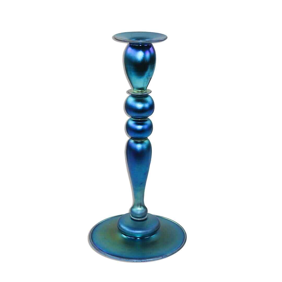 Steuben Blue Aurene Iridescent Glass Candlestick 11 7/8 in Antique: Steuben Blue Aurene Iridescent Glass Candlestick 11 7/8 in Antique This exquisite Steuben Blue Aurene Glass Candlestick is a stunning example of early 20th-century art glass. Standing at 11 7/8 inches
