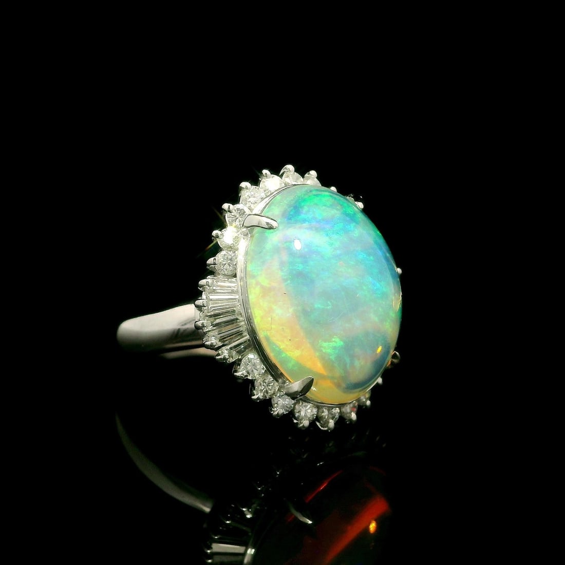 Vibrant 6.59ct Australian Jelly Opal Diamond Halo Cocktail Ring in Platinum: Vibrant 6.59ct Australian Jelly Opal Diamond Halo Cocktail Ring in Platinum Showcase your style with this stunning cocktail ring featuring a vibrant 6.59 carat total weight of Australian Jelly Opal su