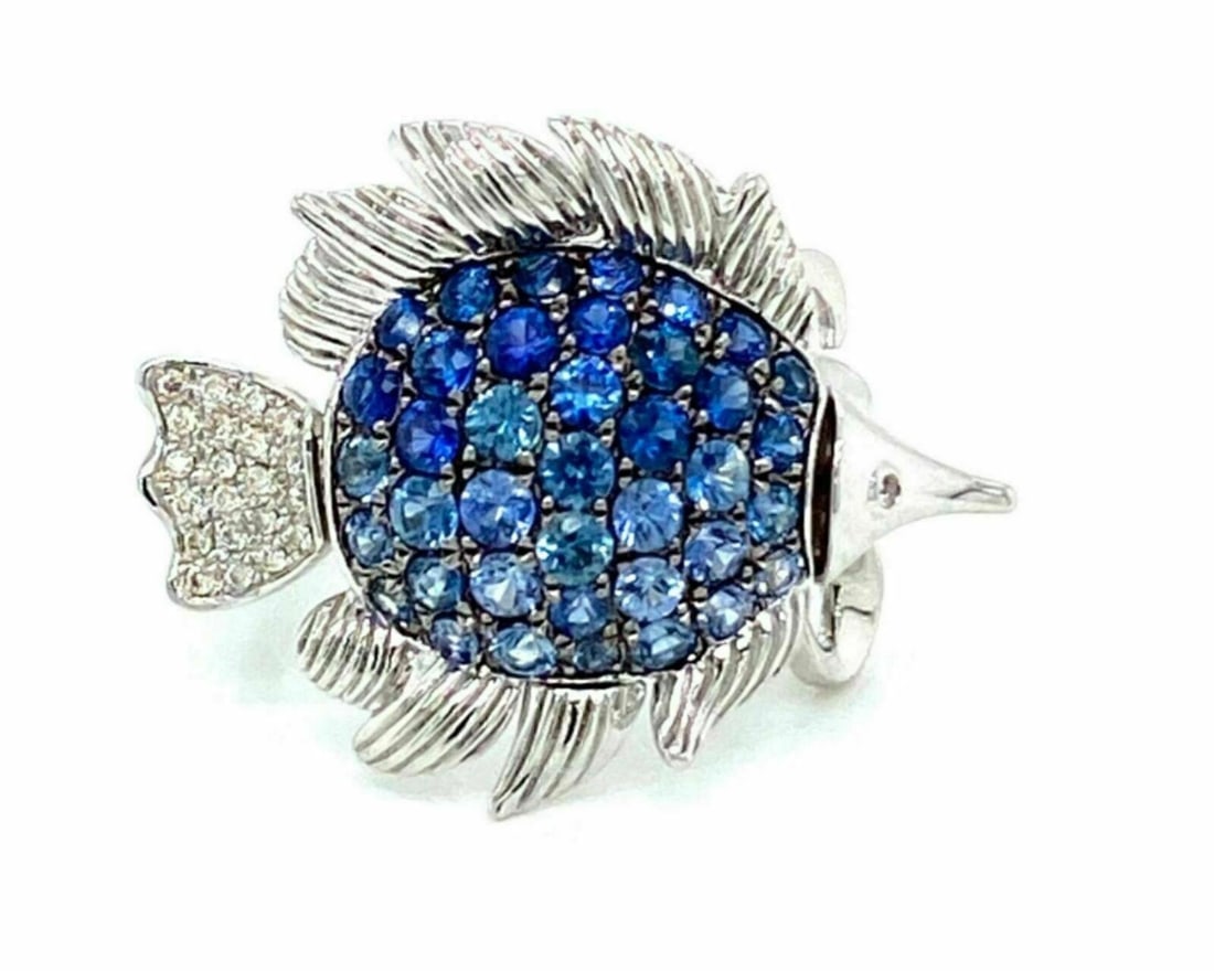 Sapphire Diamond Movable Fish Ring in 14k White Gold: Sapphire Diamond Movable Fish Ring in 14k White Gold Introducing a stunning Sapphire & Diamond Movable Fish Ring crafted in 14k white gold. This exquisite piece features a unique fish design that adds