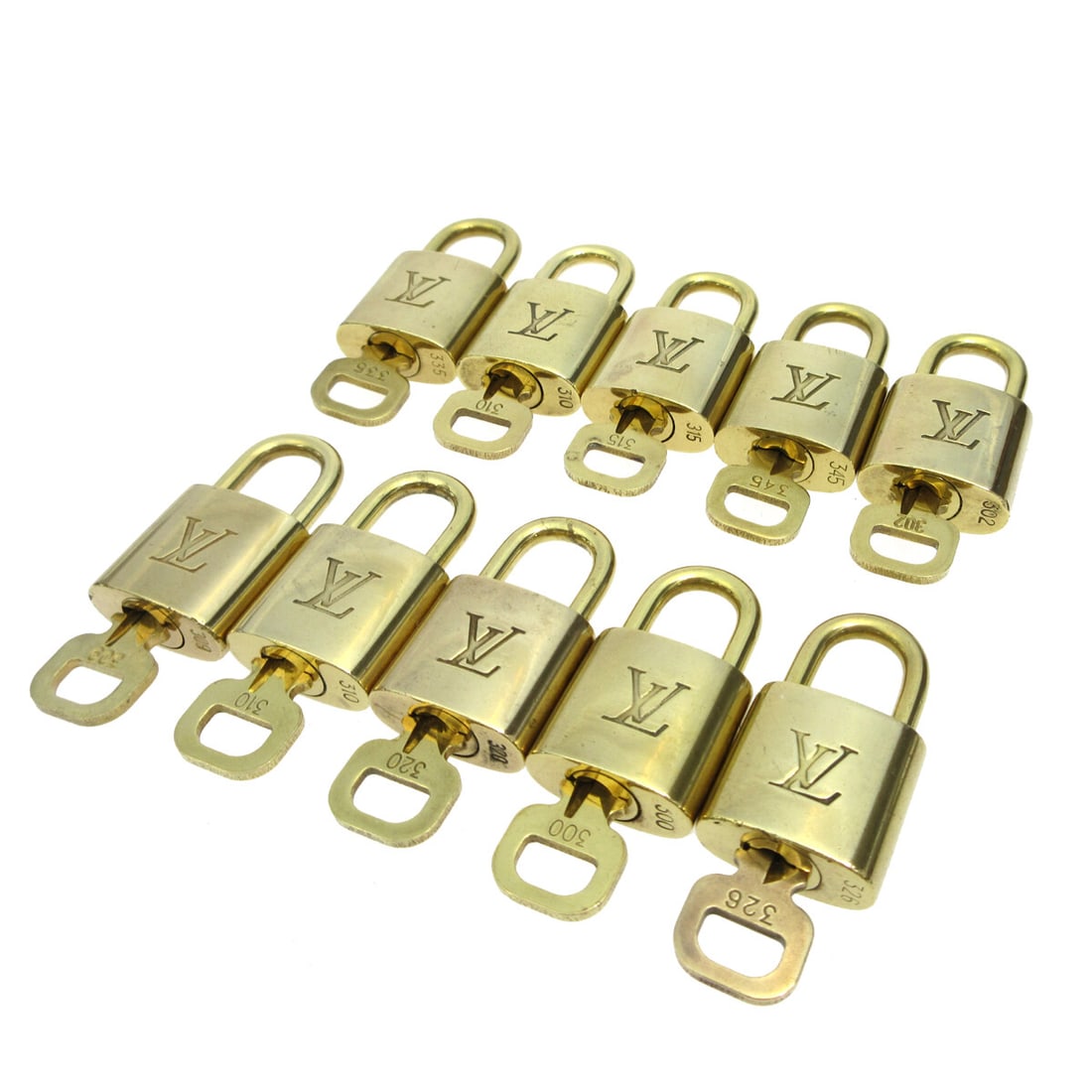 Louis Vuitton Gold Padlock & Key Bag Accessories 10 Piece Set: Louis Vuitton Gold Padlock & Key Bag Accessories 10 Piece Set Enhance your Louis Vuitton collection with this exquisite 10-piece set of Padlock & Key Bag Accessories. Crafted in a stunning gold color,