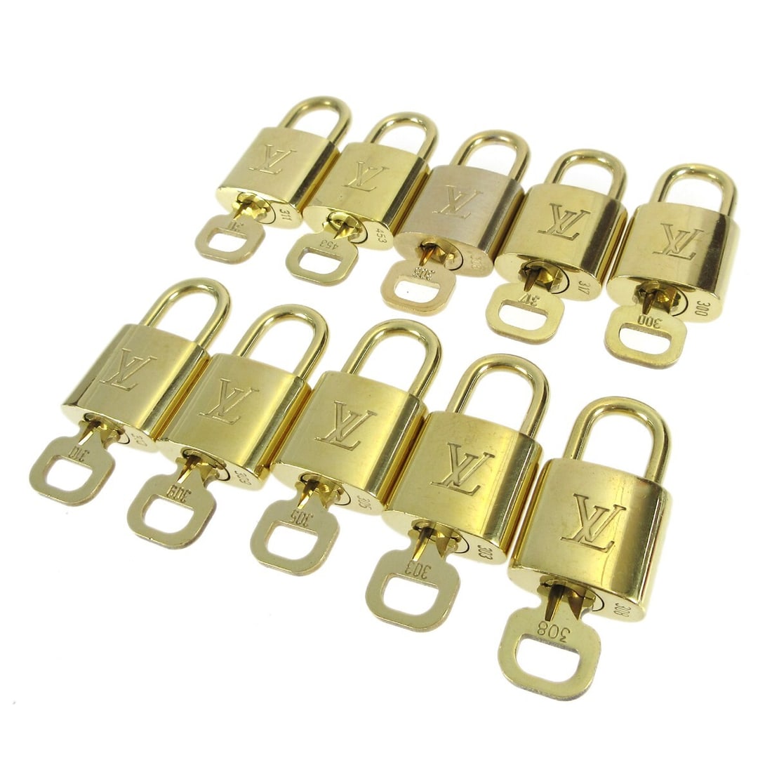 Louis Vuitton Gold-tone 10 Piece Padlock & Key Bag Charm Set: Louis Vuitton Gold-tone 10 Piece Padlock & Key Bag Charm Set Enhance your Louis Vuitton collection with this stunning 10-piece set of Padlock & Key Bag Accessories. Each piece is crafted in a luxuriou