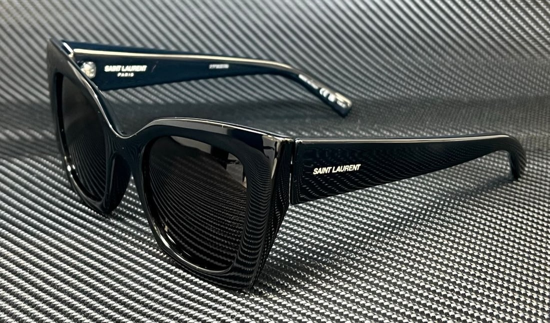 Saint Laurent SL 552 001 Cat Eye Sunglasses Black Grey 51mm: Saint Laurent SL 552 001 Cat Eye Sunglasses Black Grey 51mm Elevate your style with these Saint Laurent SL 552 001 sunglasses, featuring a striking cat-eye design. The solid black frame is complemente