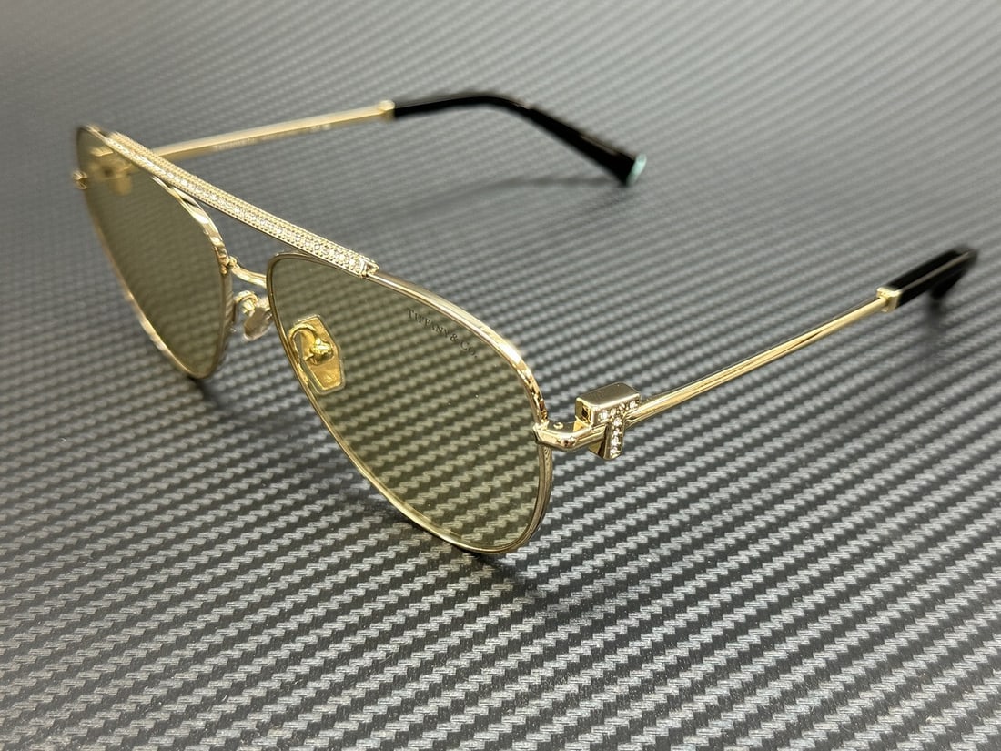 Tiffany & Co. TF3101B 6210M4 Gold Yellow Photochromic Women's Sunglasses: Tiffany & Co. TF3101B 6210M4 Gold Yellow Photochromic Women's Sunglasses Elevate your eyewear collection with these Tiffany & Co. TF3101B 6210M4 sunglasses, featuring an elegant gold frame that exudes