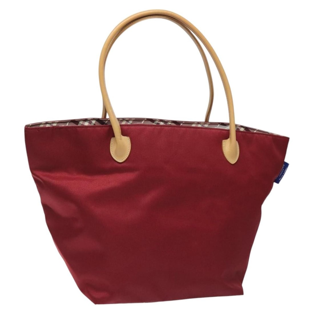 BURBERRY Blue Label Tote Bag Nylon Red Made in Japan: BURBERRY Blue Label Tote Bag Nylon Red Made in Japan This BURBERRY Blue Label Tote Bag is crafted from durable nylon in a vibrant red color, making it a stylish and functional accessory. Designed for