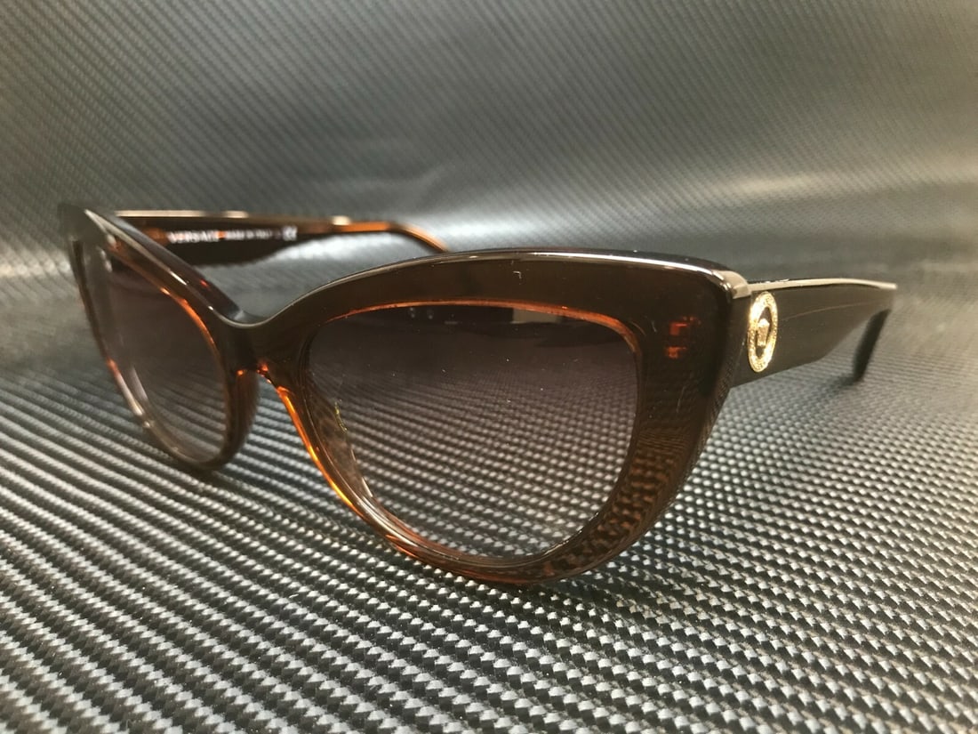 Versace VE4388 53240P Cat Eye Sunglasses Transparent Brown 54mm: Versace VE4388 53240P Cat Eye Sunglasses Transparent Brown 54mm Elevate your style with these stunning Versace VE4388 53240P Cat Eye sunglasses. Featuring a fashionable transparent brown frame and cle