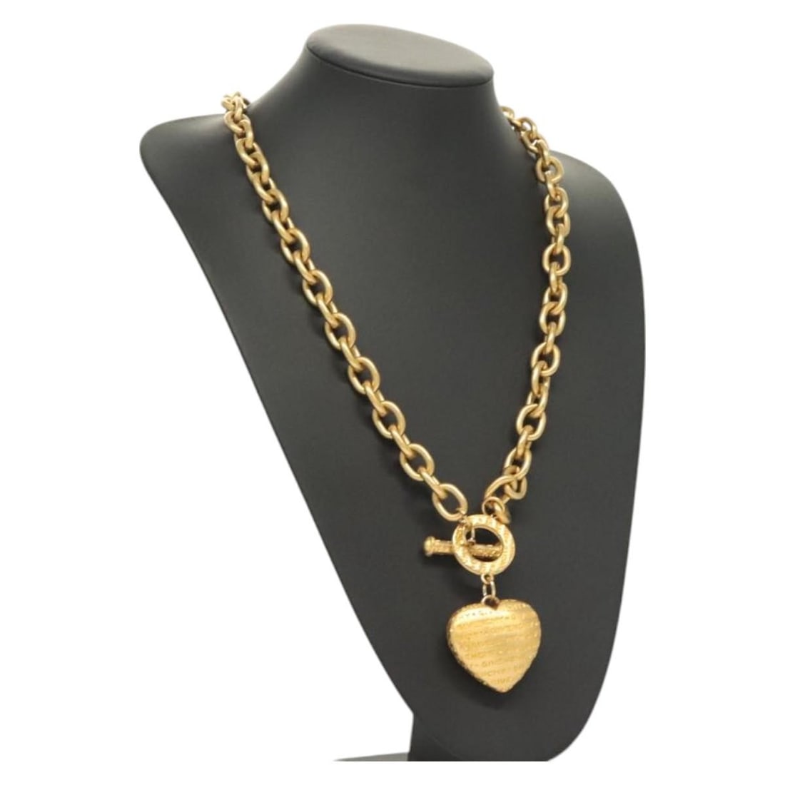 GIVENCHY Gold Heart Necklace Authentic Metal Design: GIVENCHY Gold Heart Necklace Authentic Metal Design This GIVENCHY Heart Necklace is a stunning piece crafted from high-quality metal with a luxurious gold finish. Designed to make a bold statement, th